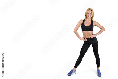 Beautiful smiling fitness woman isolated on white background © gearstd
