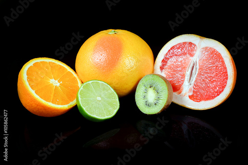 Fresh citrus isolated on black background with reflections