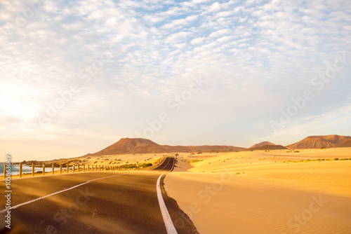 Sandstorm on the desert road on Corralejo dunes on Fuerteventura island in Spain