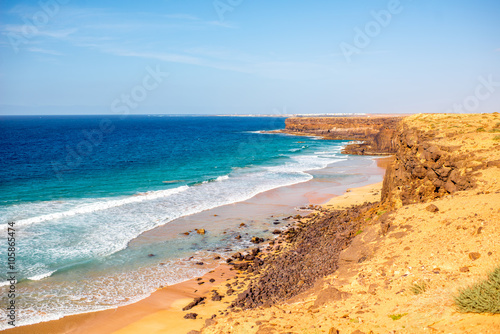 Sandy rocky coastline on the north western part of Fuerteventura island near El Cotillo village © rh2010