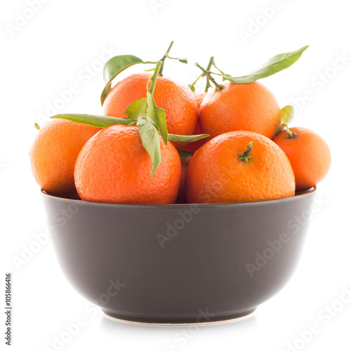 Tangerines on ceramic brown  bowl