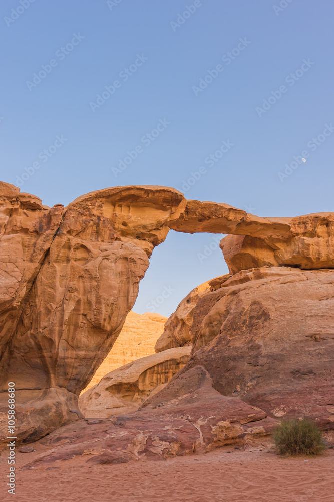 Natural Bridge with moon in Wadi Rum, Jordan Natural Bridge with moon in Wadi Rum, Jordan