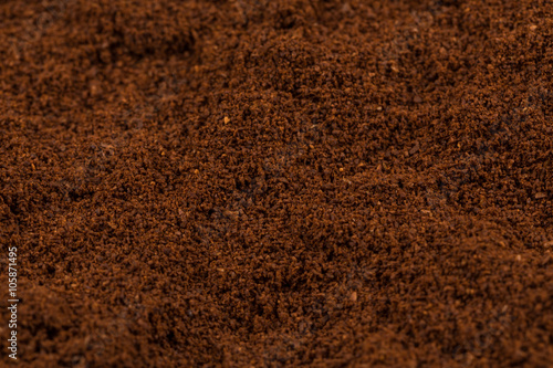 Coffee bean on powder closeup