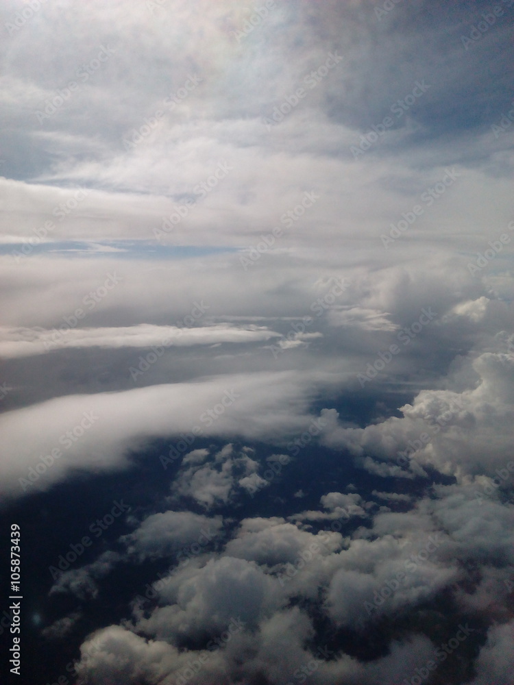 Scenic view of clouds and sky from an airplane window