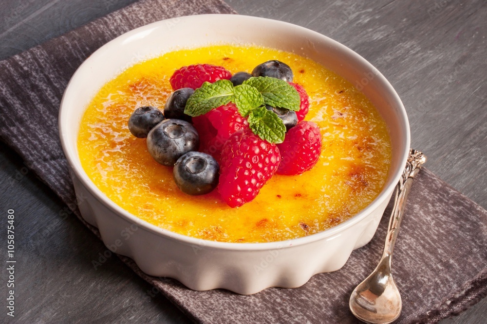 Creme brulee Dessert wih fruits and mint leaves Creme brulee Dessert wih fruits and mint leaves