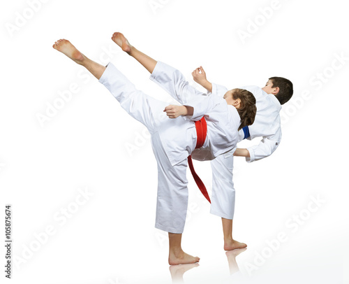 Man and woman performing a high kick