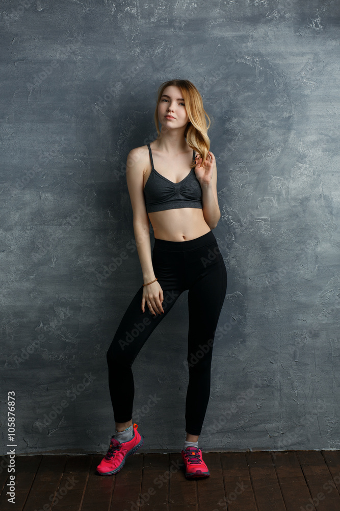 Beautiful fitness sexy girl in studio