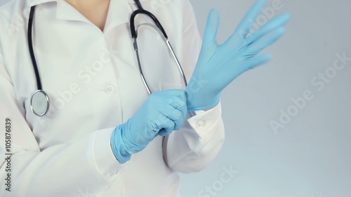 Funny female venerology or proctology therapist making scary gestures with hands photo