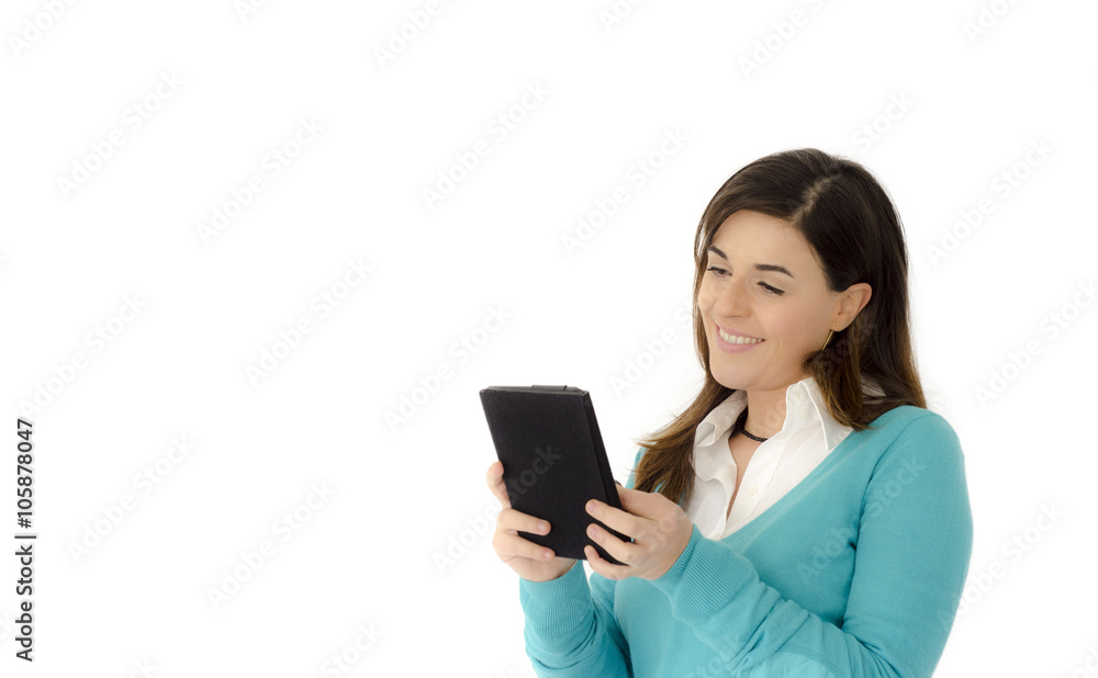 Beautiful girl smiling reading on a table portrait isolated on white background Beautiful girl smiling reading on a table portrait isolated on white background