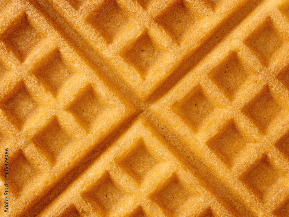 rustic traditional waffle with butter and maple syrup