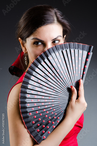 Woman with fan dancing dances