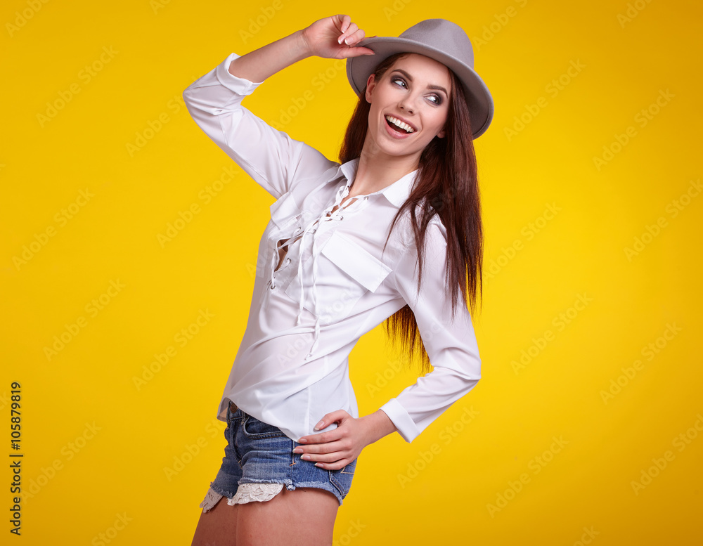 young brunette woman in spring color isolated on yellow backgrou young brunette woman in spring color isolated on yellow backgrou