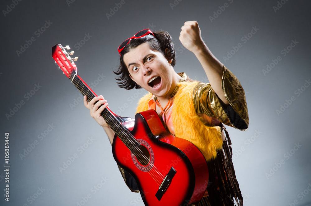Fototapeta premium Man with guitar in musical concept