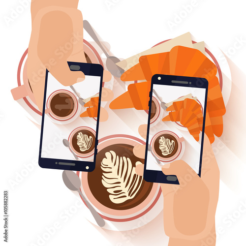 Hands making a smartphone photo of breakfast 