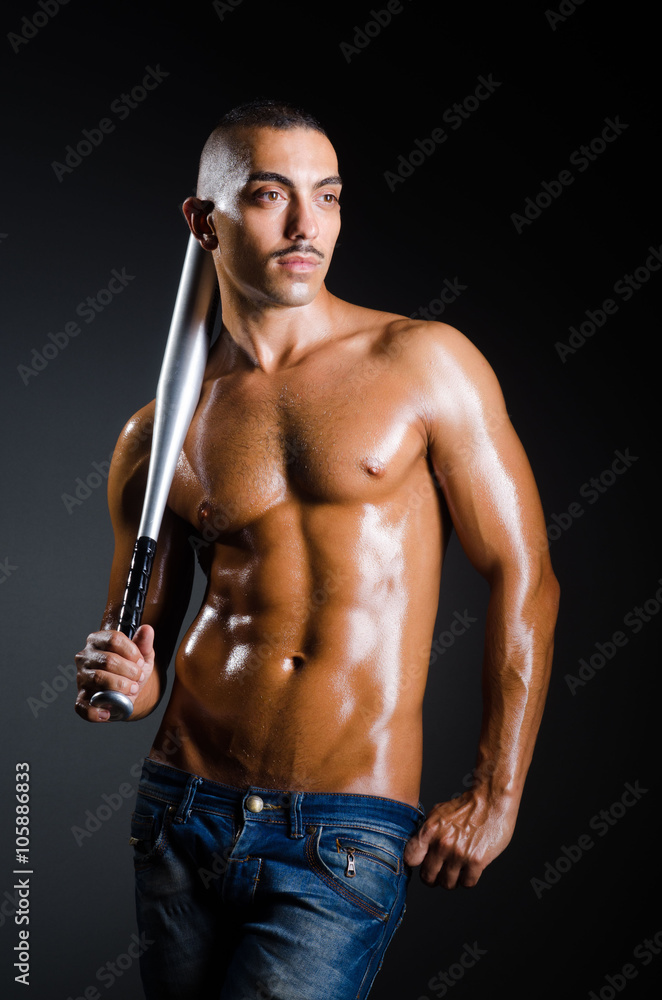 Ripped man with baseball bat Ripped man with baseball bat