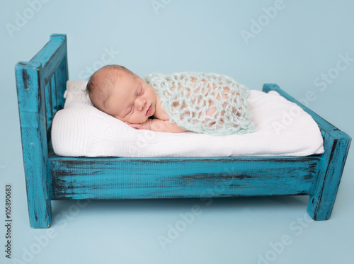 Newborn Baby Sleeping on Bed