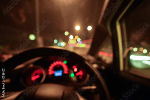 Abstract bokeh of car speed meter light dashboard with traffic