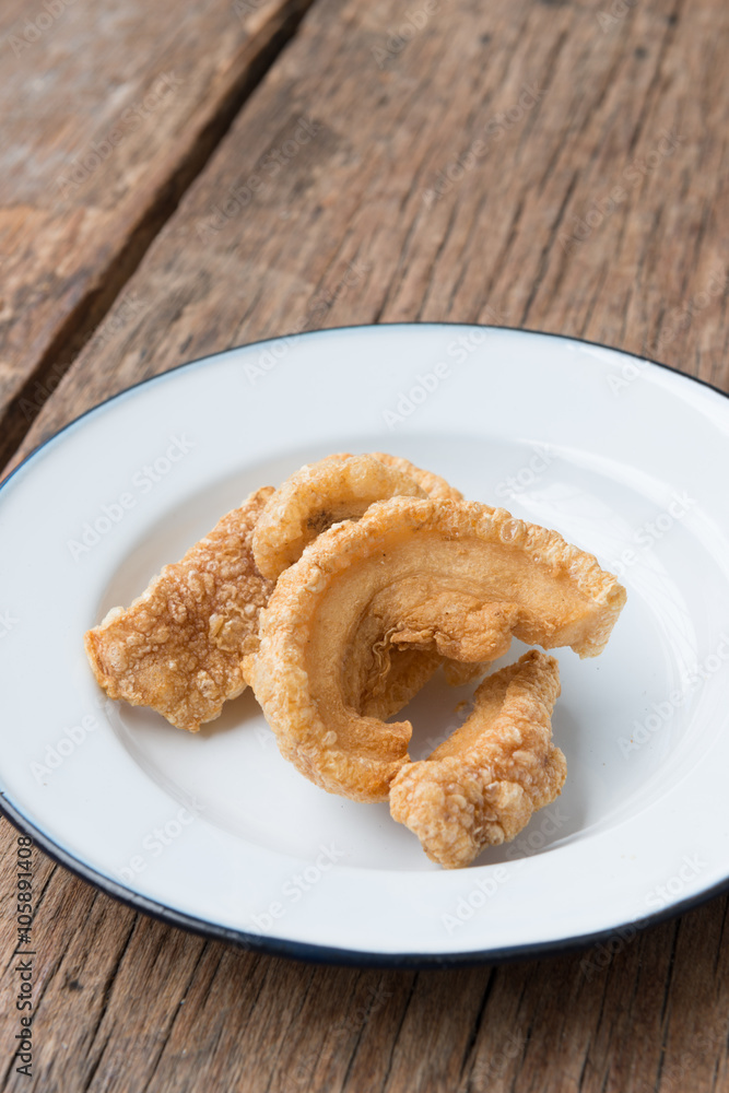 Pork rinds also known as chicharon or chicharrones, deep fried p Pork rinds also known as chicharon or chicharrones, deep fried p