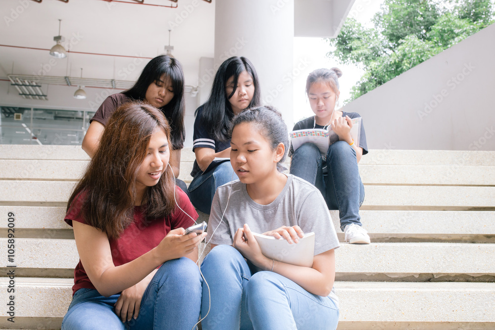 group of happy teen high school students outdoors, Asian, tutoring, Laptop, Tablet group of happy teen high school students outdoors, Asian, tutoring, Laptop, Tablet