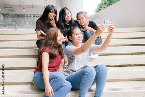 group of happy teen high school students outdoors, Asian, tutoring, Take a photo