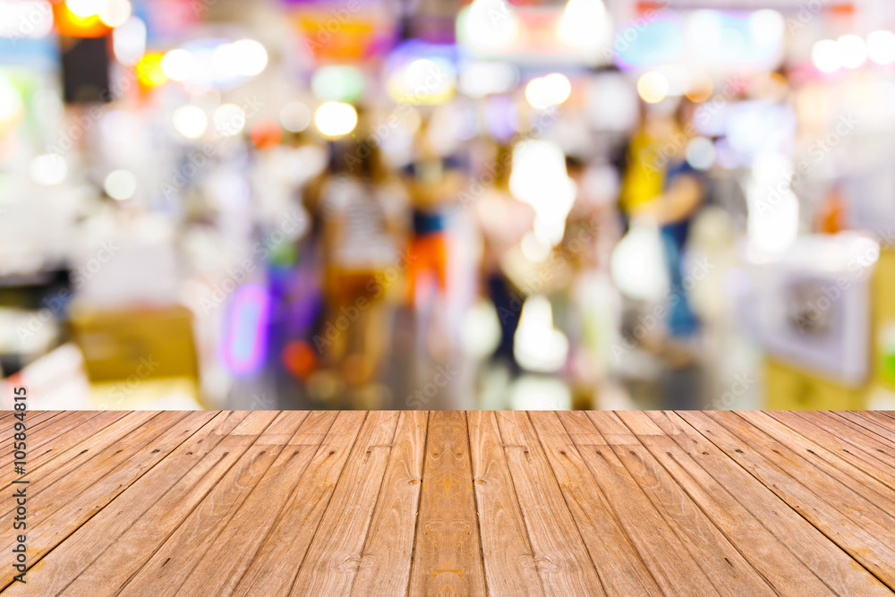 Old wooden table with blur people background