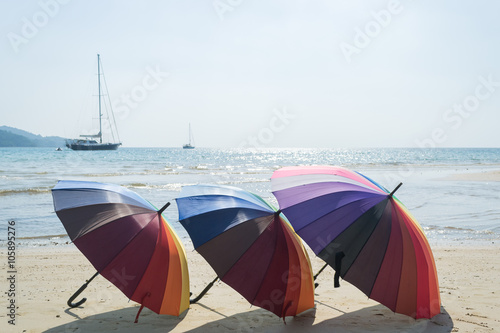 colorful of beach umbrella with sky and beach background