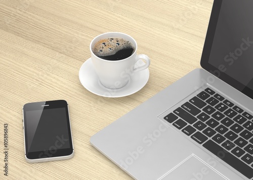 Laptop smartphone and coffee cup on wood table