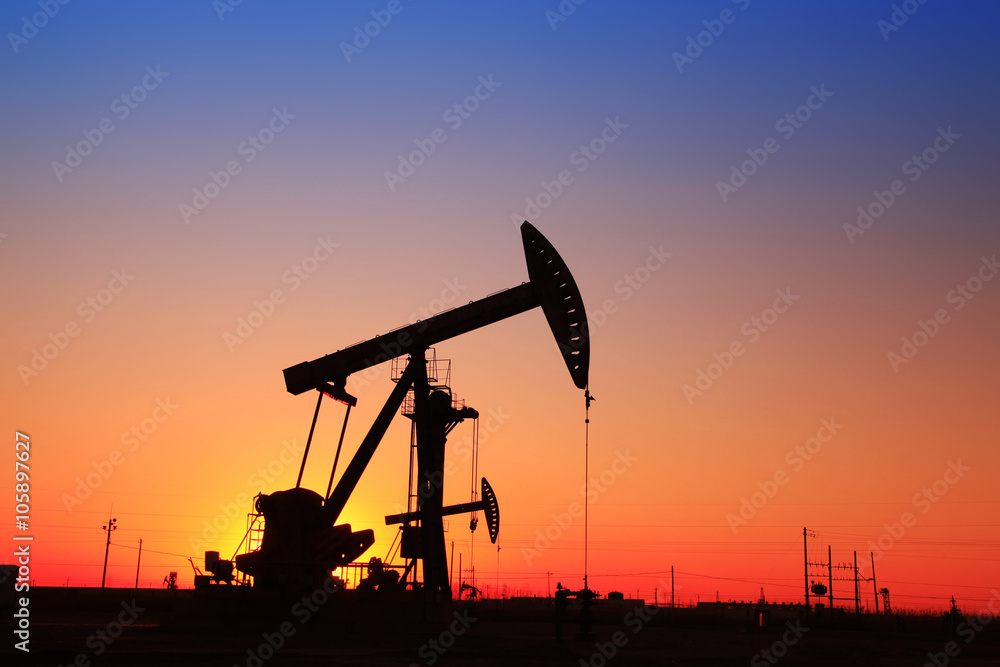 In the evening, the silhouette of the oil pump In the evening, the silhouette of the oil pump