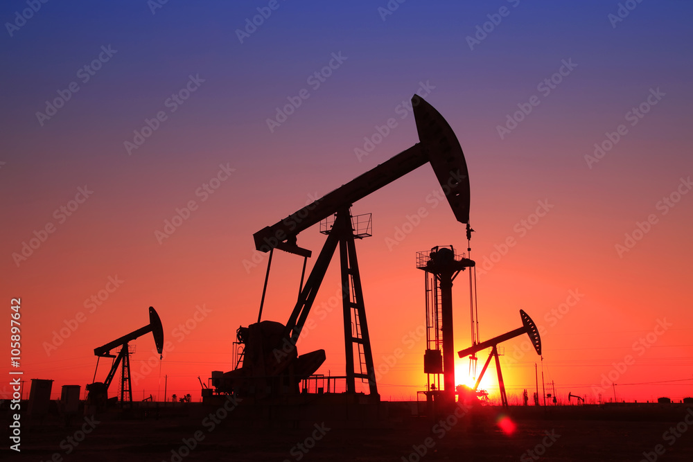 In the evening, the silhouette of the oil pump In the evening, the silhouette of the oil pump