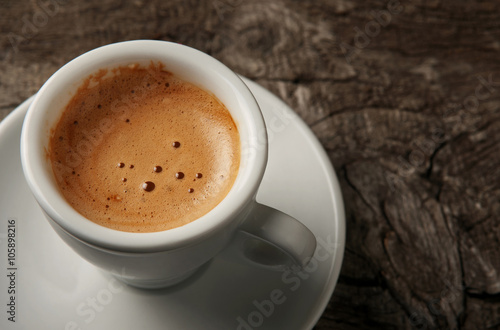 Canvas Print Closeup cup of coffee espresso with foam