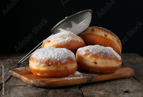 Stack of donuts with powdered sugar
