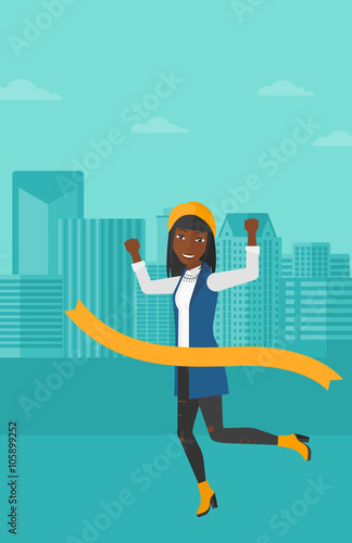 Business woman crossing finish line.