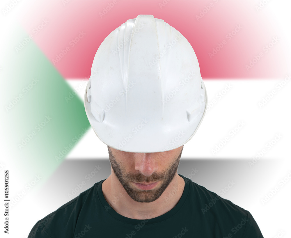 Engineer with flag on background - Sudan Engineer with flag on background - Sudan
