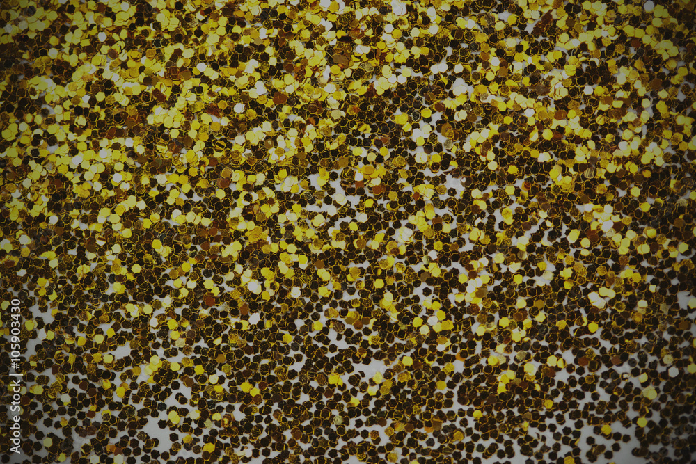 Close up a fine shining gold glitter Close up a fine shining gold glitter