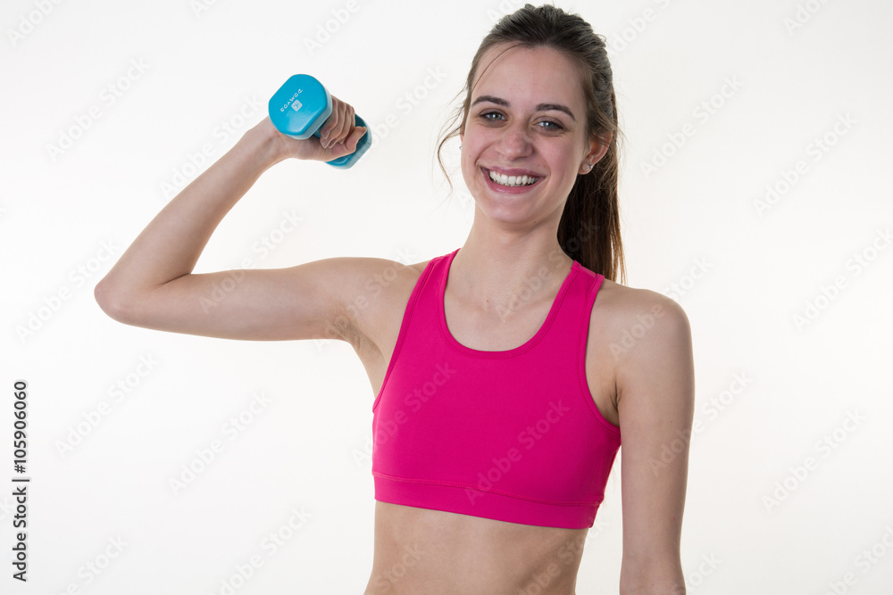 Beautiful brunette working out with dumbbells over white background Beautiful brunette working out with dumbbells over white background