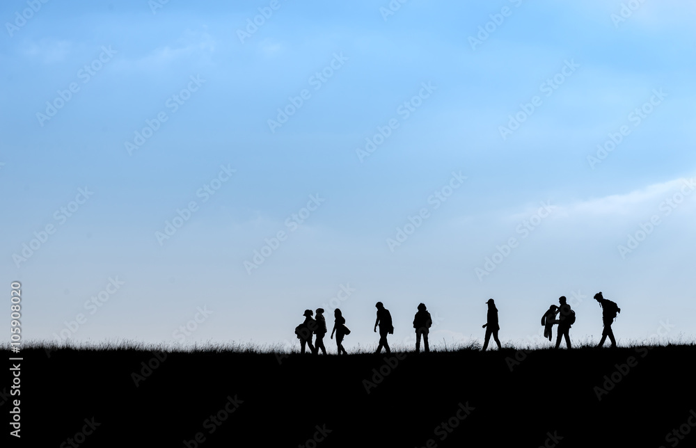 Silhouette of human scale hike and trail on mountain Silhouette of human scale hike and trail on mountain