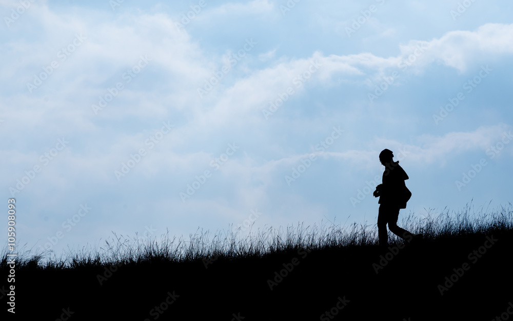 Silhouette of human scale hike and trail on mountain Silhouette of human scale hike and trail on mountain