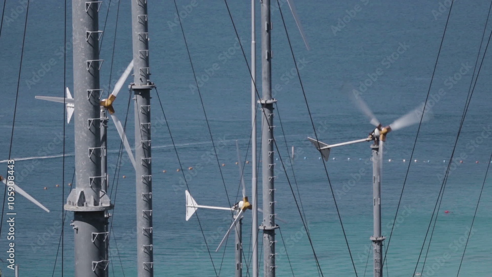 Spinning turbine blades at wind farm on the shore of Koh Larn island in Thailand
Spinning turbine blades at wind farm on the shore of Koh Larn island in Thailand