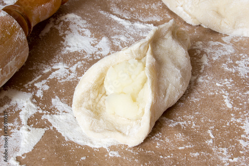 Dough on table with flour.