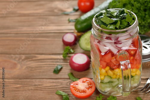 Fresh vegetable salad in Mason jar