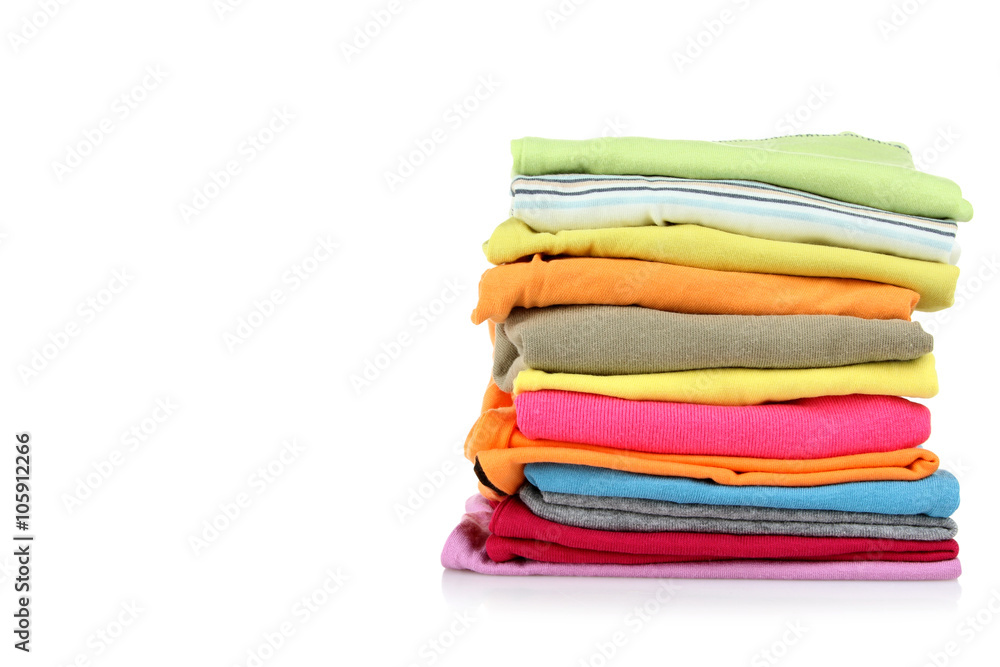 clothes neatly folded on white isolated background clothes neatly folded on white isolated background