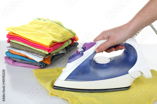 woman stroking Flatiron clothing on a white background isolated