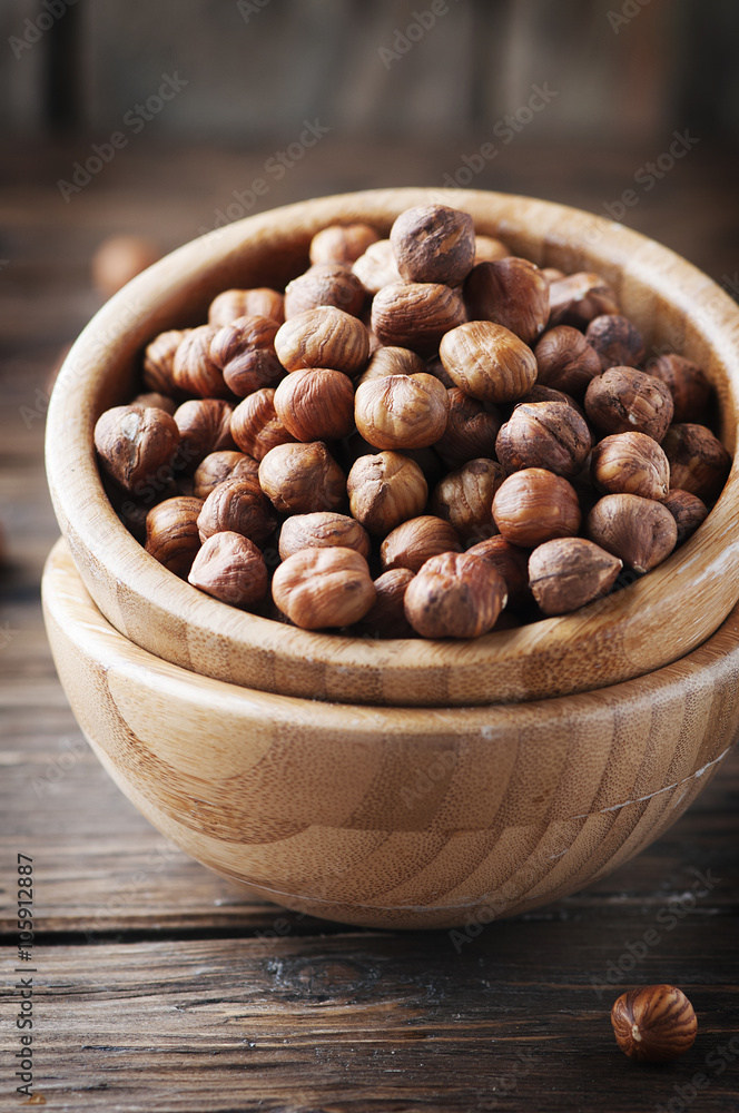 Healthy raw hazelnut on the wooden table Healthy raw hazelnut on the wooden table