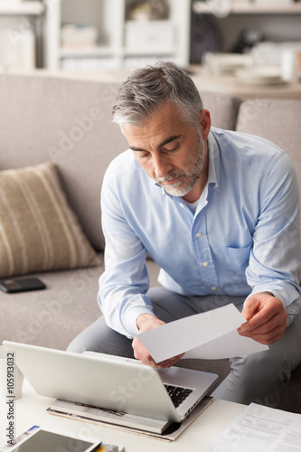 Businessman checking bills