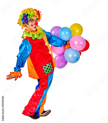 Happy birthday clown man holding bunch of balloons. Isolated.