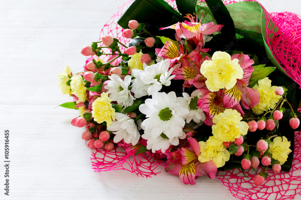 Beautiful bouquet of colorful flowers, white chrysanthemums and