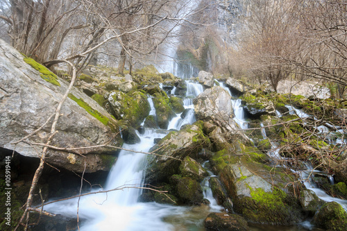 Bild auf Leinwand Waterfall in the birth of the river Ason, Cantabria, Spain