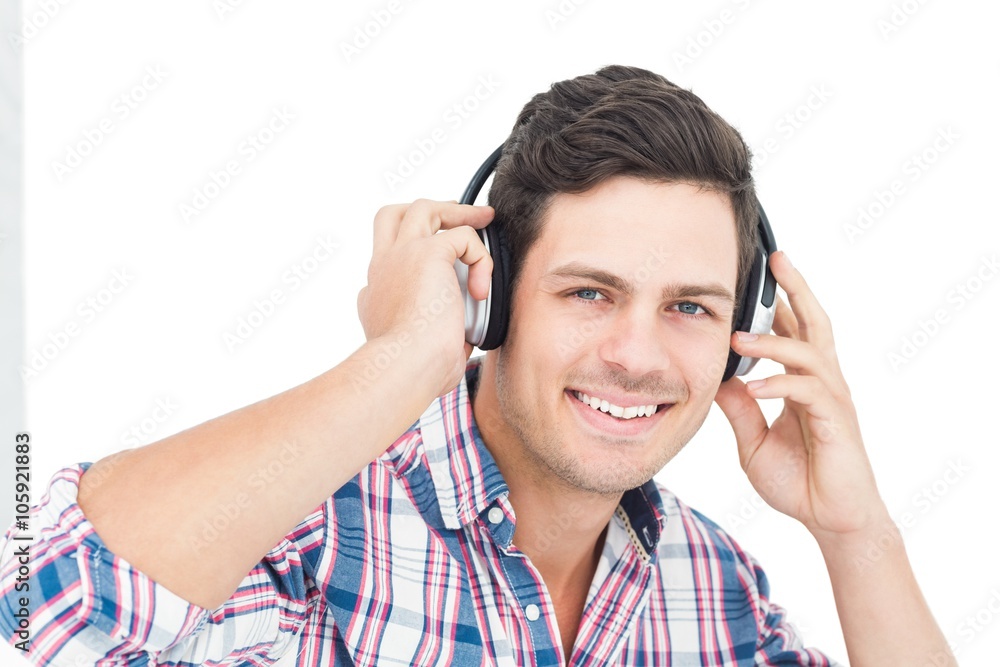 Man with headphones sitting on the floor Man with headphones sitting on the floor