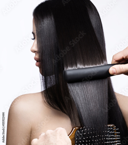 Tablou pe pânză Beautiful brunette girl with a perfectly smooth hair, curling and classic make-up