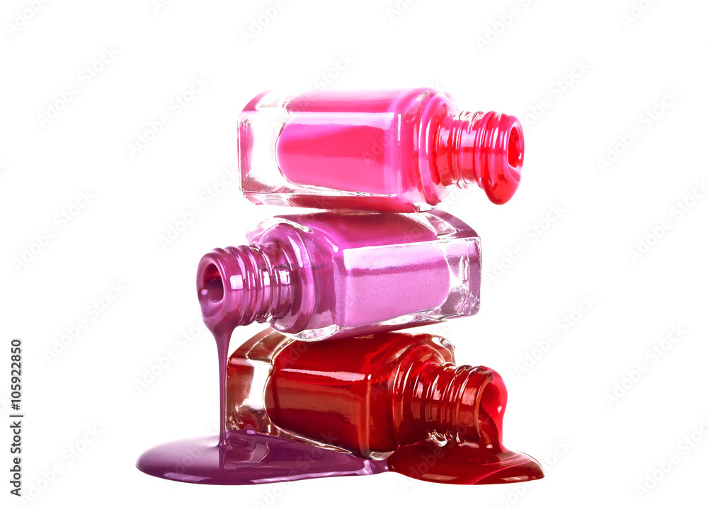 Bottles with spilled nail polish on a white background Bottles with spilled nail polish on a white background